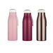 A selection of three Stainless steel water bottles. One is a Light Pink Colour. The Second is a Mauve Colour and the third bottle is a bronze colour. They all have matching off white lids.