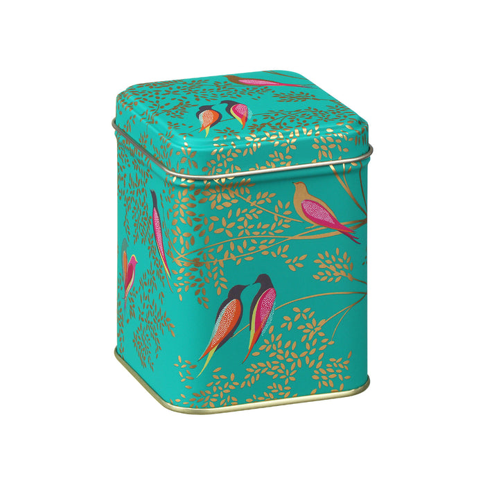 Decorative small square tin colour is teal with gold and pink bird design on the tin.
