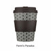 Reusable coffee cup with geometric pattern and black lid on a white background