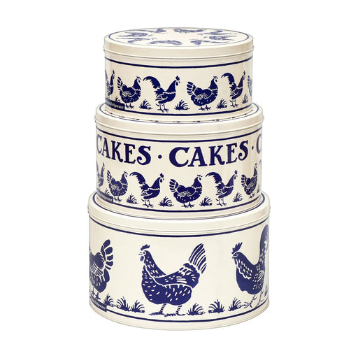 Set of 3 Emma Bridgewater cake tins one of top of the other. The tins are round and cream in colour and feature navy blue hens in a large repeated design around the sides of the tins. 