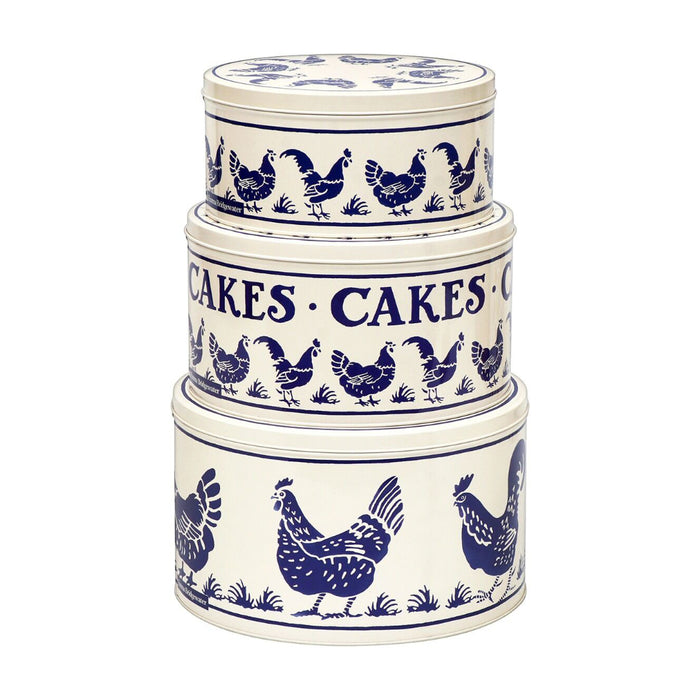 Set of 3 Emma Bridgewater cake tins one of top of the other. The tins are round and cream in colour and feature navy blue hens in a large repeated design around the sides of the tins. 