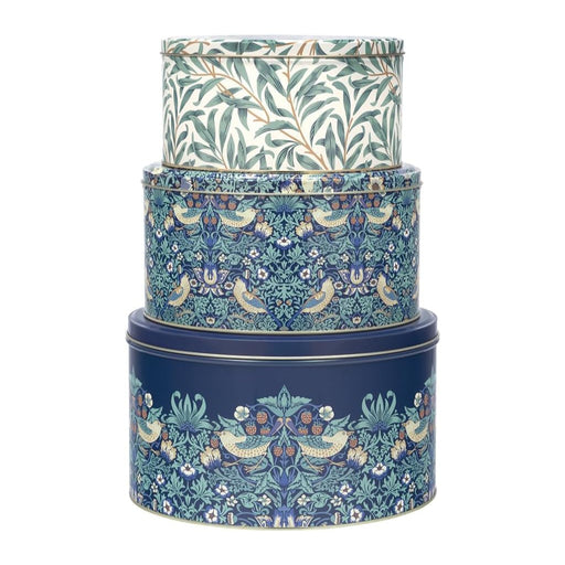 Buy Now William Morris Strawberry Thief inspired set of three cake tins with blue floral patterns along with small birds and strawberries. 3 tins on top of each other on a white background 