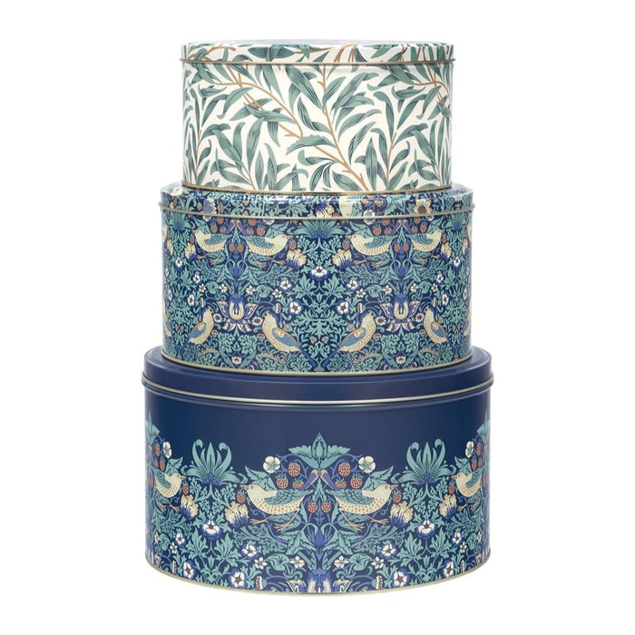 Buy Now William Morris Strawberry Thief inspired set of three cake tins with blue floral patterns along with small birds and strawberries. 3 tins on top of each other on a white background 