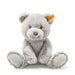Gray teddy bear with a yellow tag on a white background