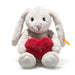 White plush bunny with a red heart and measurement label on a white background