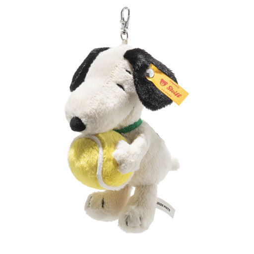 Plush dog toy with a tennis ball, held by a keychain, on a white background