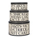 Stack of three decorative cake tins with text on a white background