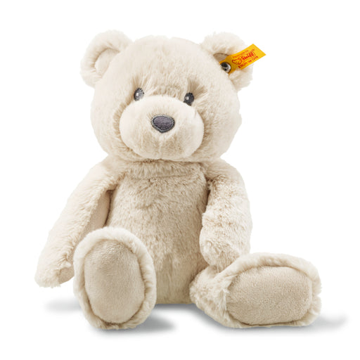 Beige teddy bear with a visible brand tag on a white background