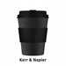 Black reusable coffee cup with a visible brand logo on a white background