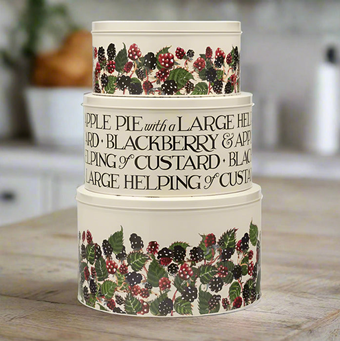 Stack of three ceramic containers with blackberry design and text on a white background