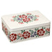 Rectangular tin box with floral design on a white background