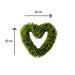 Heart-shaped green wreath with measurements on a white background