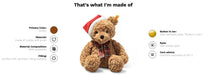 Teddy bear with a Santa hat and plaid scarf, showing material composition details on a white background.