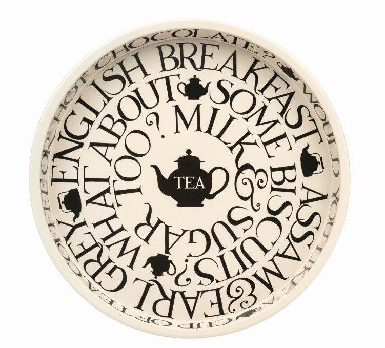 Decorative plate with tea-themed text and teapot illustrations on a white background
