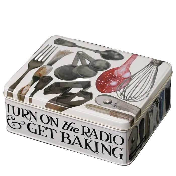Tin box with kitchen utensil illustrations and text 'Turn on the Radio & Get Baking' on a white background