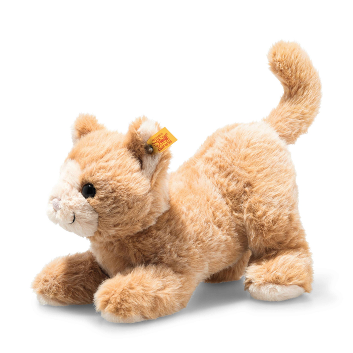 Plush toy cat lying down on a white background
