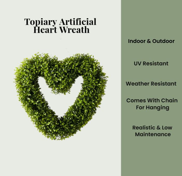 Heart-shaped topiary artificial wreath with text on a light gray background
