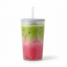 A clear plastic travel tumbler with a silver lid and white straw, filled with a layered pink and green iced drink, isolated on a white background.