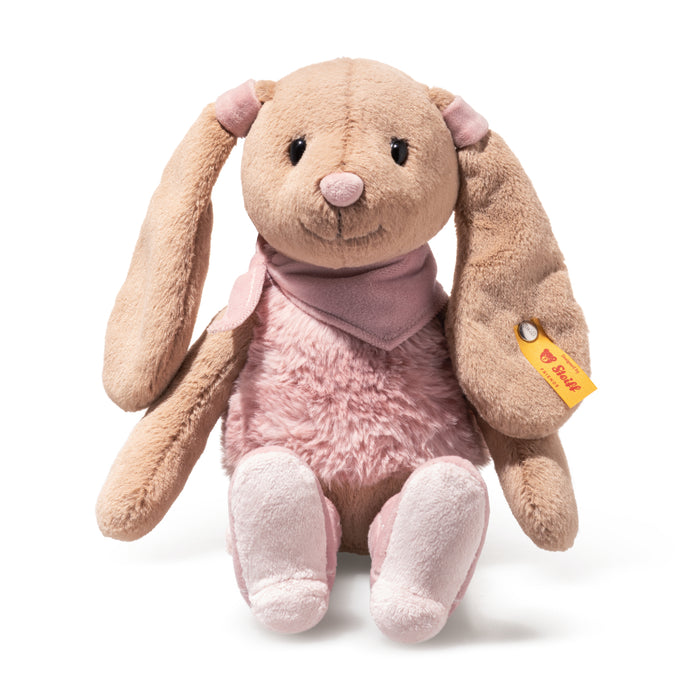 Plush toy rabbit with pink body and beige ears on a white background