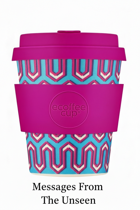 Reusable coffee cup with pink lid and geometric pattern on a white background