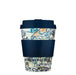 Reusable coffee cup with patterned design and navy lid and sleeve on a white background