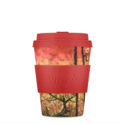 Reusable coffee cup with red lid and sleeve featuring a nature-themed design on a white background