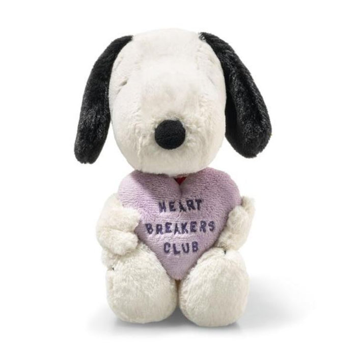 Stuffed dog toy with a heart-shaped 'Heart Breakers Club' pillow on a white background