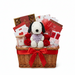 Valentine's Day gift basket with Snoopy, flowers, and chocolates on a white background