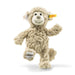 Plush monkey toy with a yellow tag on a white background