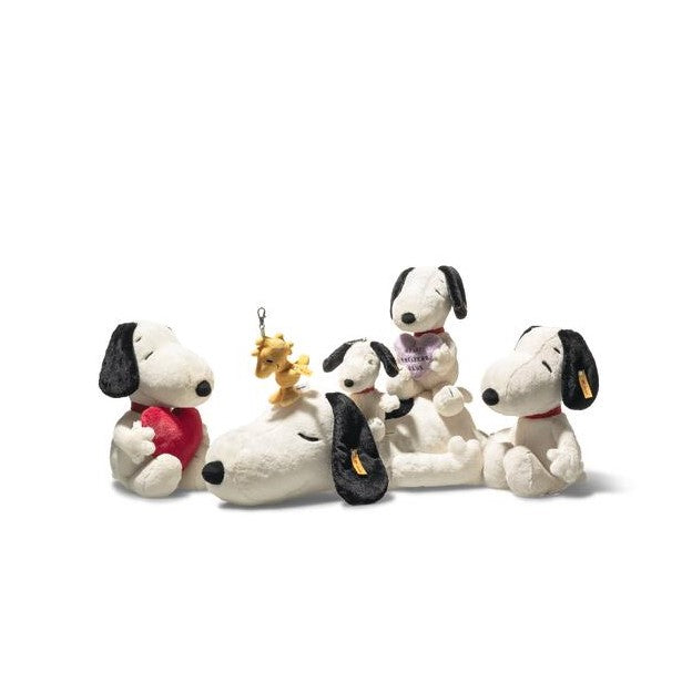 Set of Snoopy and Woodstock plush toys on a white background
