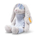 Plush toy rabbit with rainbow-colored eyes on a white background