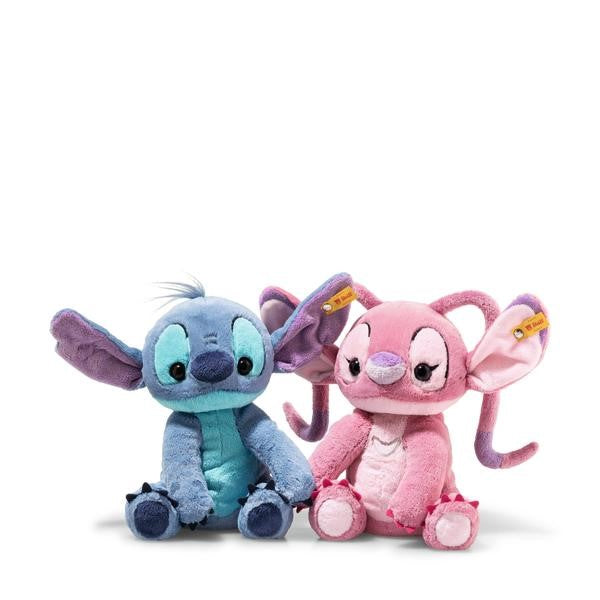 Two plush toys, one blue and one pink, on a white background