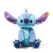 Plush toy resembling a character with blue and purple colors on a white background