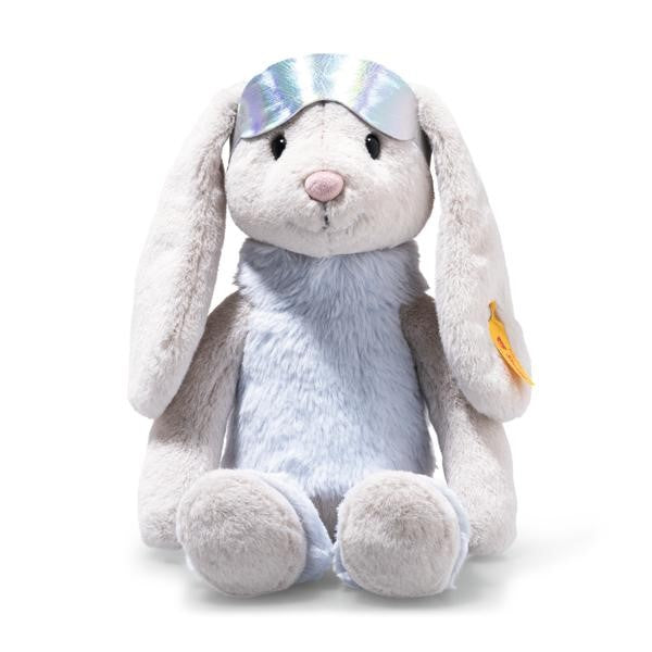Plush toy rabbit with a silver tiara on a white background
