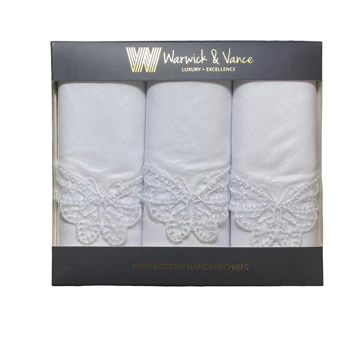 Box of three white handkerchiefs with lace details, branded Warwick & Vance.