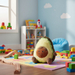 Avocado-shaped plush toy on a colorful play mat with toys and books in the background