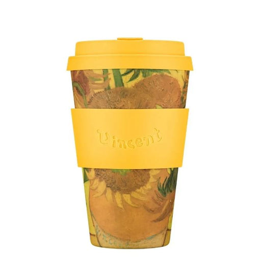 Reusable coffee cup with sunflower design and yellow lid and sleeve on a white background