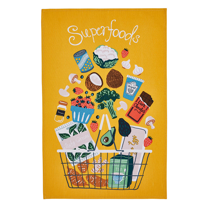 superfoods themed tea towel with mustard background and various health food items coming out of a shopping basket