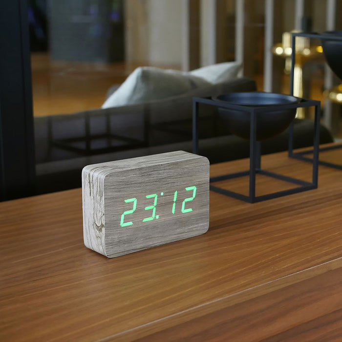 Gingko brick LED click clock in an ash coloured wooden effect displaying the time in light green