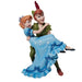 Peter pan is dressed in green whilst holding Wendy Darling who is dressed in a light blue night dress 