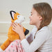 young girl holding warmies heat up fox toy 