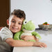boy holding warmies frog heatable toy