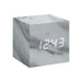 Gingko Cube LED Click Clock in a marble effect, displaying the time in white