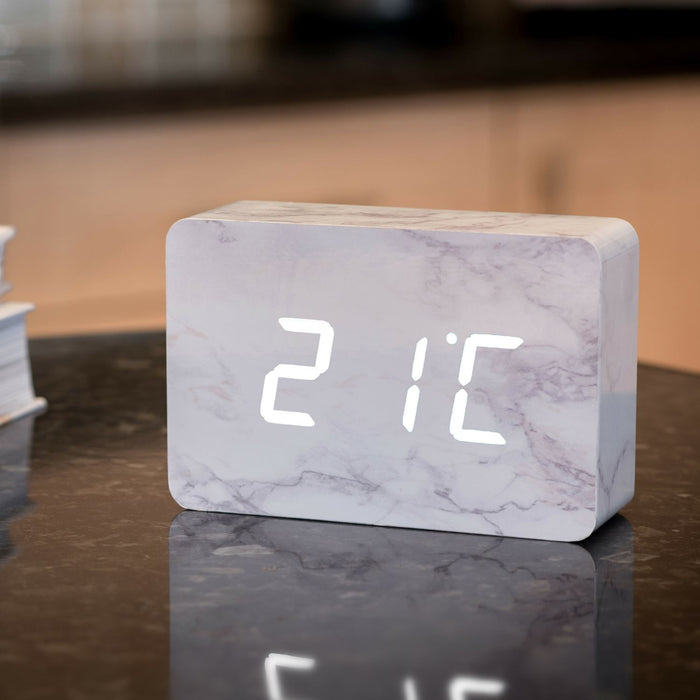 Gingko brick LED click clock in a white marble effect displaying the temperature in white