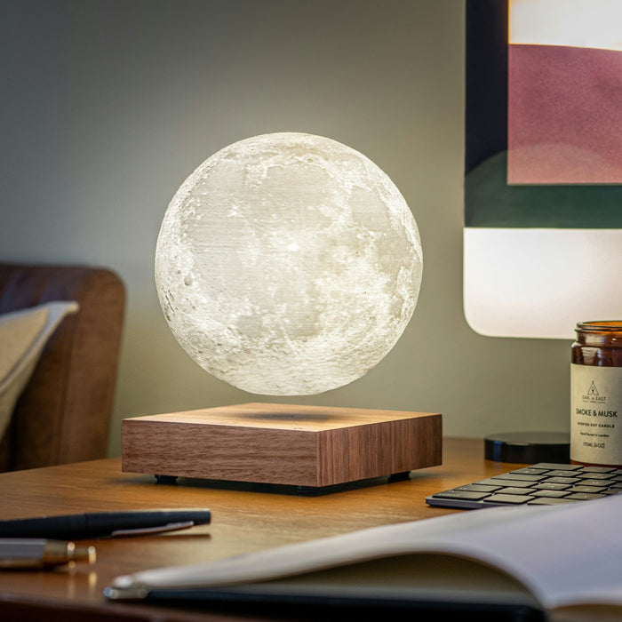 gingko smart 3d printed floating LED moon lamp on a walnut base