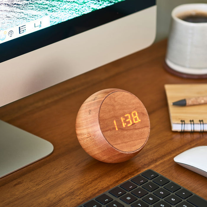 Gingko Design Cherry Wood Alarm Clock With Digital LED Display On A Work Desk