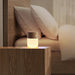 gingko white ash effect smart diffuser placed on a bedside table