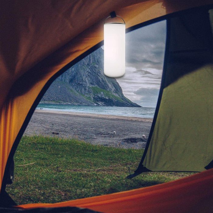xtralite LED reverse lamp with touch controls being used in a tent on the beach
