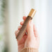 person holding gingko natural wood flameless lighter in american walnut