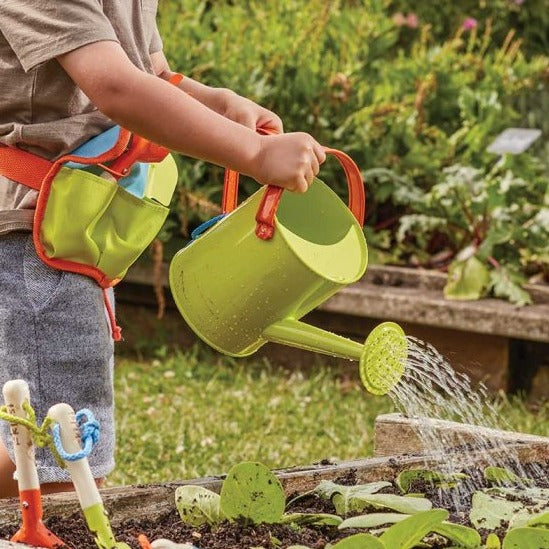 child using smart garden kids green watering can